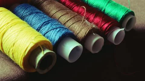 Multicolor sewing threads background bobbins Stock Photos