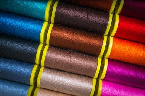 Multicolor sewing threads background - concept of sewing Stock Photos