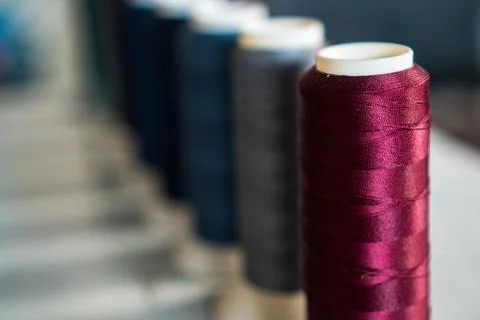 Multicolor sewing threads background Stock Photos