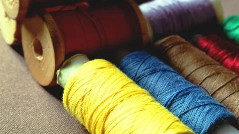 Multicolor sewing threads background reel bobbins Stock Photos