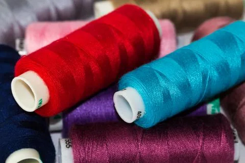 Multicolor sewing threads. Close up. Background texture. Stock Photos