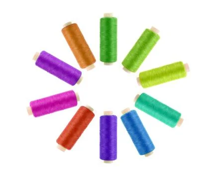Multicolor sewing threads on white background Stock Photos