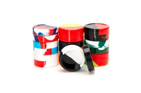 Multicolor Silicone Concentrate Containers Stacked on White Background Stock Photos