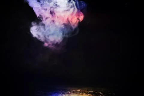 Multicolor smoke on black background Stock Photos