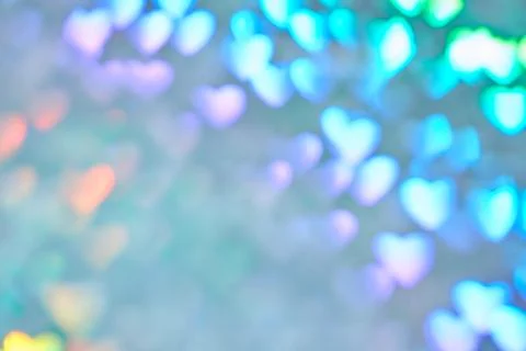 Multicolor space blurred three-dimensional heart-shaped bokeh, neon juicy bri 스톡 사진