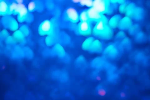 Multicolor space blurred three-dimensional heart-shaped bokeh, neon juicy bri Stock Photos