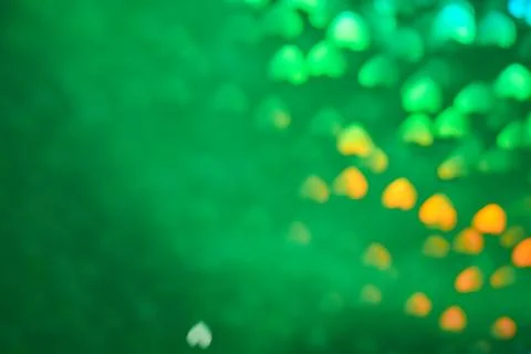 Multicolor space blurred three-dimensional heart-shaped bokeh, neon juicy bri Stock Photos