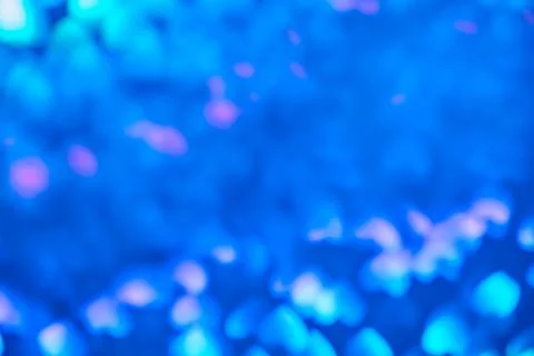 Multicolor space blurred three-dimensional heart-shaped bokeh, neon juicy bri Stock Photos