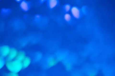 Multicolor space blurred three-dimensional heart-shaped bokeh, neon juicy bri Stock Photos