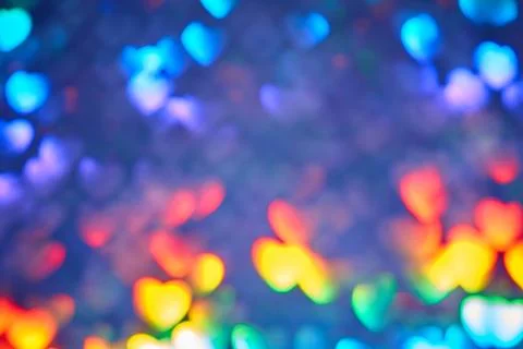 Multicolor space blurred three-dimensional heart-shaped bokeh, neon juicy bri 스톡 사진