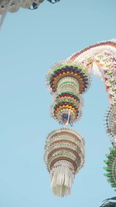 Multicolor Stacked Disc Pendant Hanging from Penjor Arch, Bali 4K Stock Footage 342384424