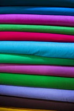 Multicolor textile fabrics pattern texture background Stock Photos