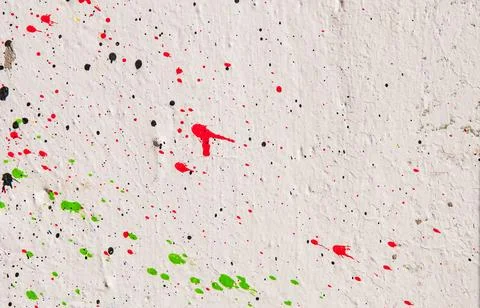 Multicolor textured background on a white wall. Blood ink splatter Stockfoto's