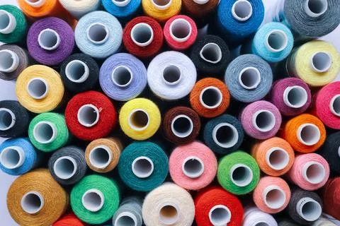Multicolor thread spools top view Stock Photos