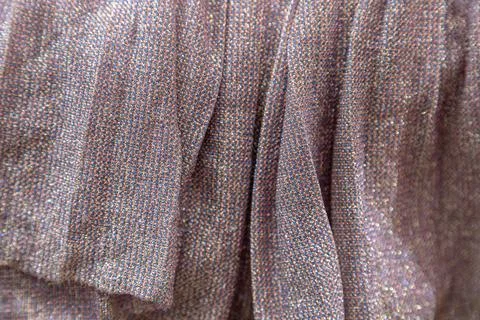 Multicolor tweed fabric texture background with shimmering detail and soft focus Stock Photos