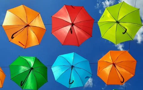Multicolor umbrellas on the sky Stock Photos