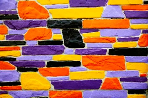 Multicolor violet and orange  brick wall Stock Photos
