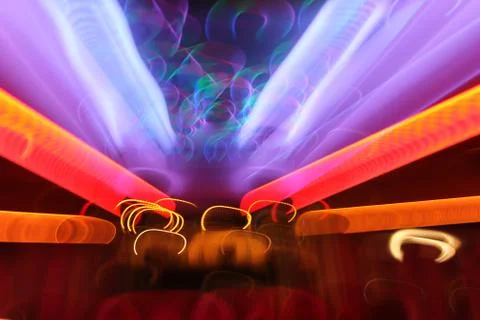 Multicolored abstract background of motion in the depth of space long exposur Stock Photos