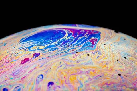 Multicolored abstract chaotic pattern inside of the soap bubble, closeup M... Foto stock