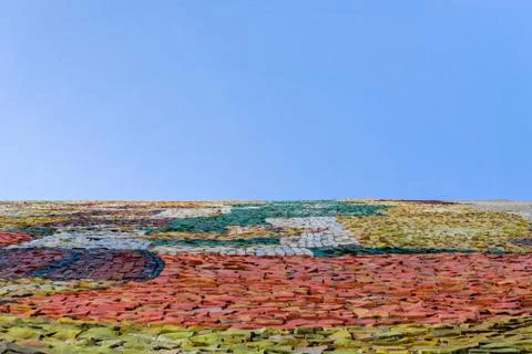 Multicolored abstract mosaic surface with high resolution with empty blue bac Stock Photos