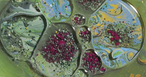 Multicolored acrylic paint bubbles move and explode in the water Stock Footage 144773929