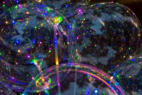 Multicolored background of glowing led balloons Stock Photos