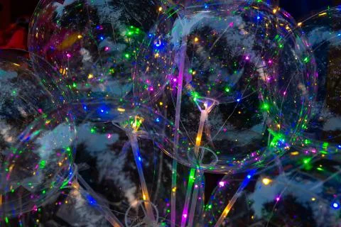 Multicolored background of glowing led balloons Foto stock
