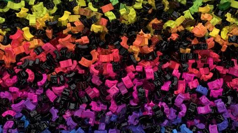 Multicolored background with heap of plastic or colored metal objects Stock Photos