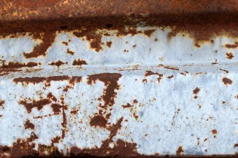 Multicolored background: rusty metal surface with blue paint flaking and Stock Photos