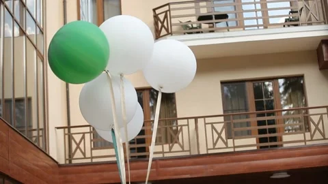 Multicolored balloons on the background of the cottage Video stock 137630545