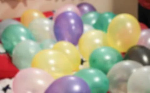 Multicolored balloons blur background Stock Photos
