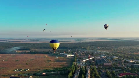 Multicolored balloons fly over trees. Nice top view of the park. Stockbeeldmateriaal 204891689