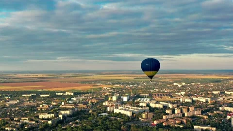 Multicolored balloons fly over trees. Nice top view of the park, forest cover Video stock 212307206