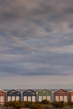 Multicolored bathing huts on the Costa Brava at the beach of Sant Pol, Sant F Stock Photos