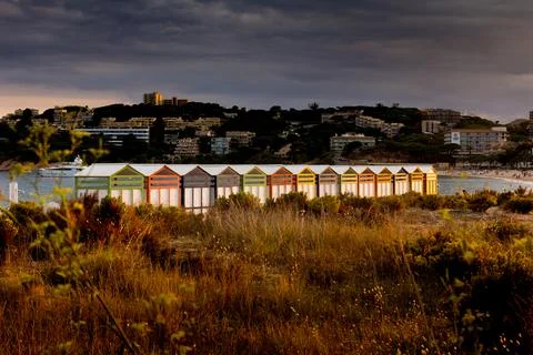 Multicolored bathing huts on the Costa Brava at the beach of Sant Pol, Sant F Stock Photos