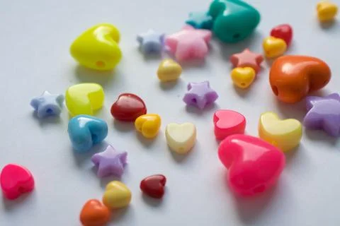 Multicolored beads on a white background Stock Photos
