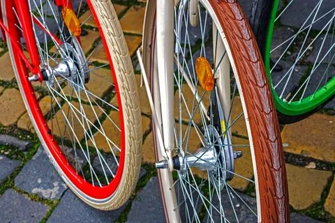 Multicolored bicycle wheels Stock Photos