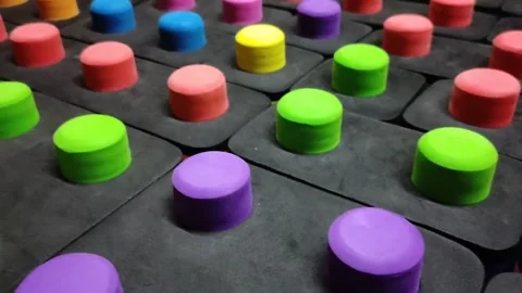 Multicolored big buttons on a black background close up Stock Footage 145731245