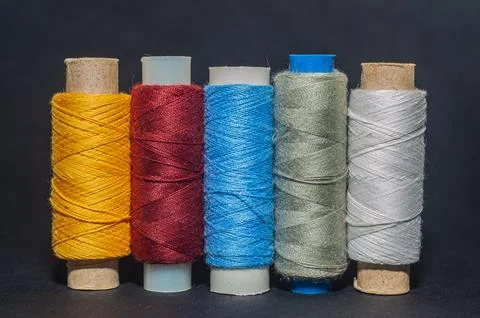 Multicolored bobbin thread. Polypropylene multifilament yarns. Set of sewing  Stock Photos