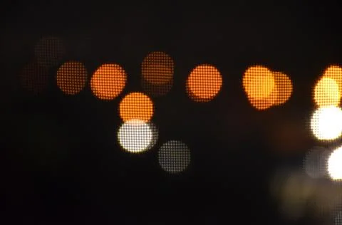 Multicolored bokeh on black background Stock Photos