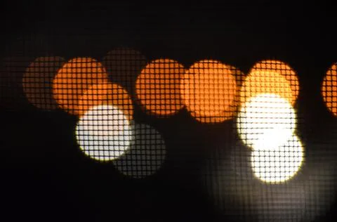 Multicolored bokeh on black background Stock Photos