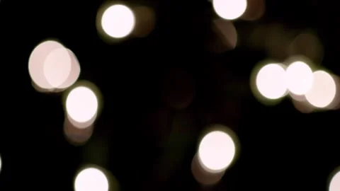 Multicolored bokeh confetti effect glimmering over a black background Vidéo 301896737