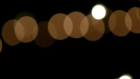 Multicolored bokeh confetti effect glimmering over a black background Vidéo 301896784