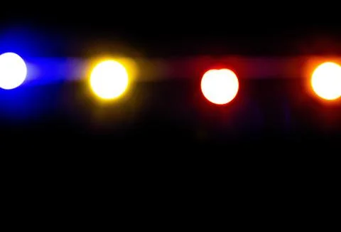 Multicolored bokeh on a dark background Stock Photos