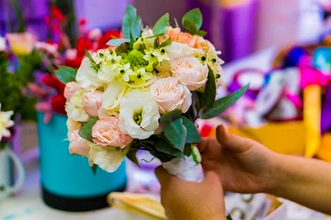 A multicolored bouquet in the hands. Stock Photos