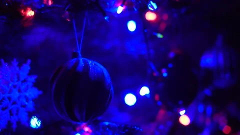 Multicolored branches of light a black background. Christmas background Stock Footage 145709951