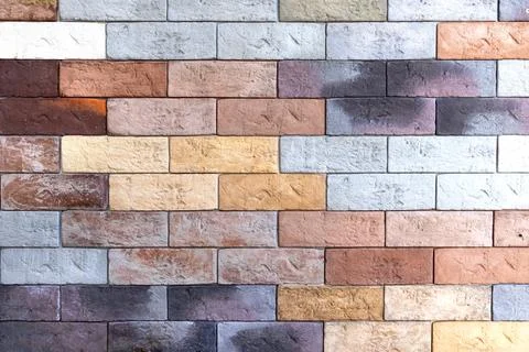 Multicolored brick wall, masonry. Abstraction, texture Stock Photos