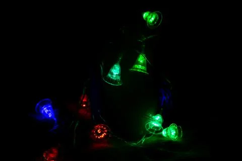 Multicolored bright lanterns on a dark background Stock Photos