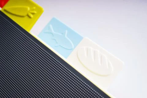 Multicolored bright plastic boards for cutting vegetables, bread, meat and other Stock Photos