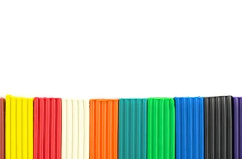 Multicolored bright plasticine on a white background, isolate Stock Photos
